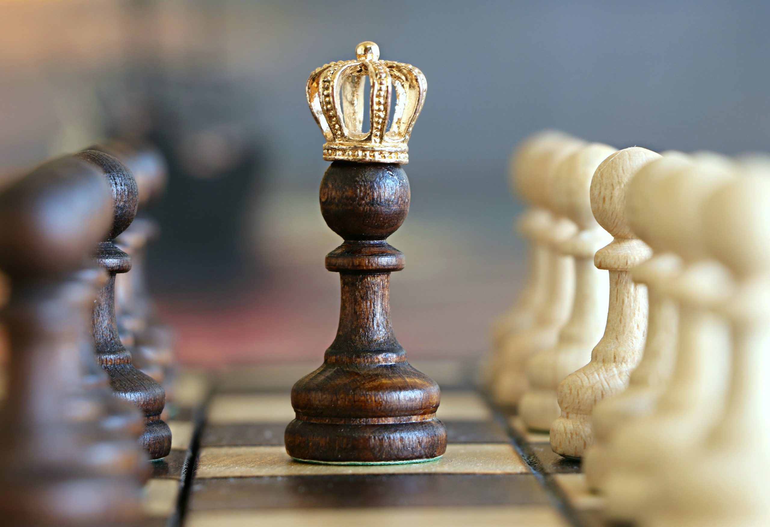 Chess board and chess piece with gold crown